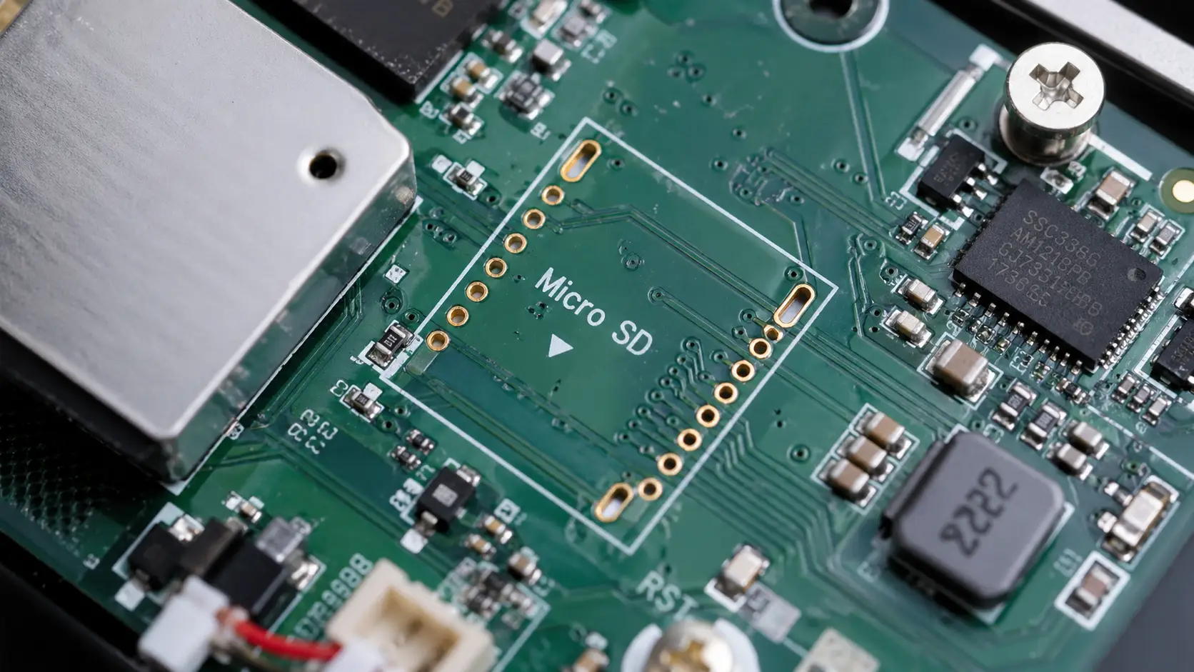 best pet camera without subscription - disassembled PCB showing a removed MicroSD slot to force cloud fees